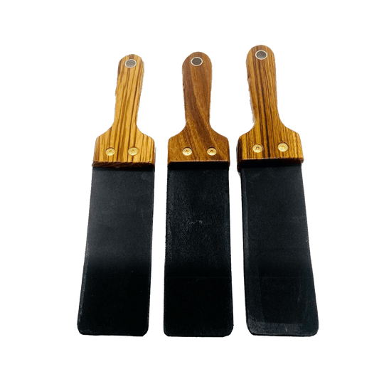 Master Control's Woodshop & Toys's Italian Leather Barber Strap - Short - This is a Handmade upon order product. The product usually takes 7-10 days to create. This Short Italian Leather Barber Strap Spanking Paddle never fails to get an "ouch" of appreci