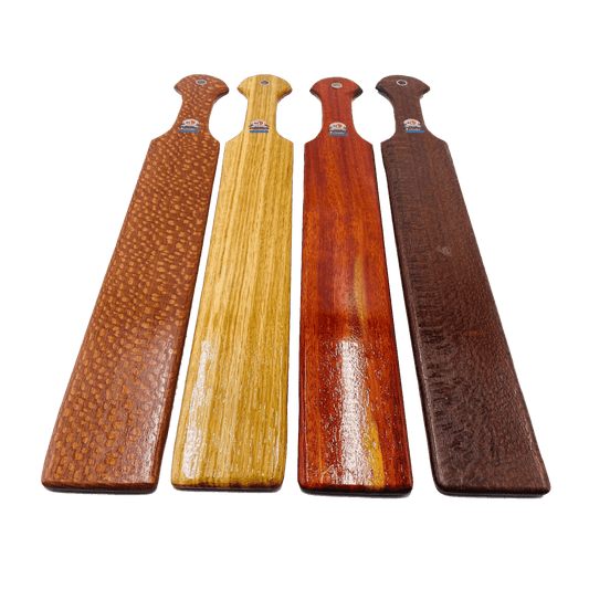 Master Control's Woodshop & Toys's 23" Long Thin OTK Spanking Paddle - This is a Handmade upon order product. The product usually takes 7-10 days to create. This Long Thin OTK Spanking Paddle never fails to get an "ouch" of appreciation! Available in seve