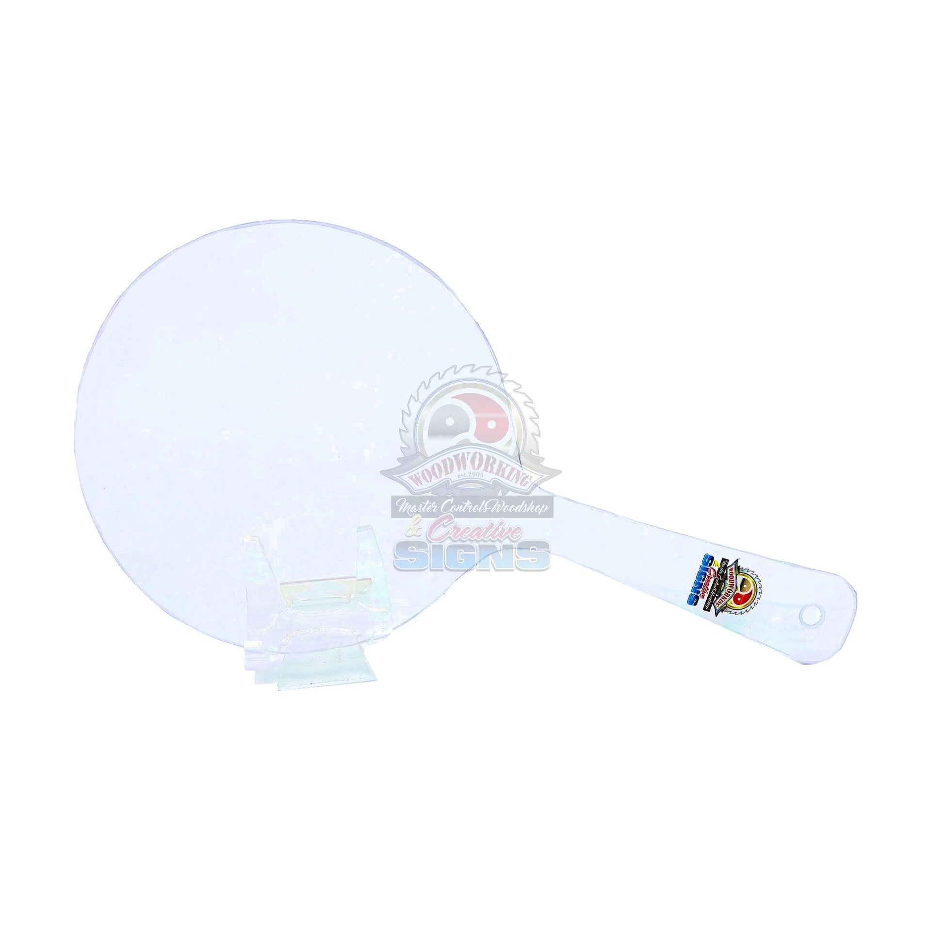 Master Control's Woodshop & Toys's Small Round Lexan Spanking Paddle - This is a Handmade upon order product. The product usually takes 7-10 days to create. This Small Round Lexan Spanking Paddle never fails to get an "ouch" of appreciation! Available in