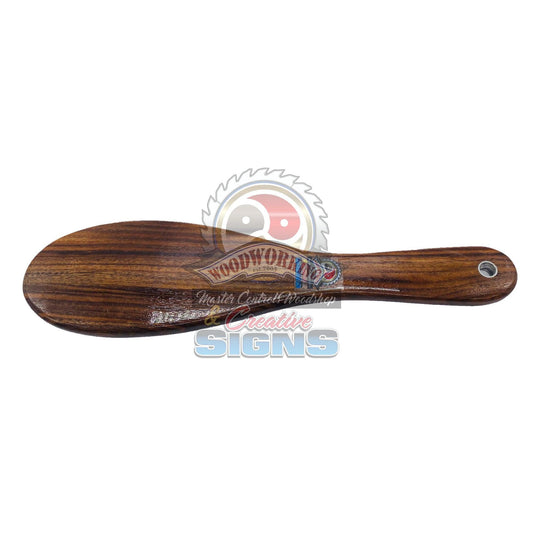 Master Control's Woodshop & Toys's Small Patu Hairbrush Spanking Paddle - This is a Handmade upon order product. The product usually takes 7-10 days to create. This Small Patu Hairbrush Spanking Paddle never fails to get an "ouch" of appreciation! Availab