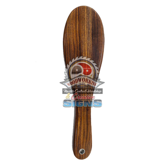 Master Control's Woodshop & Toys's Small Patu Hairbrush Spanking Paddle - This is a Handmade upon order product. The product usually takes 7-10 days to create. This Small Patu Hairbrush Spanking Paddle never fails to get an "ouch" of appreciation! Availab